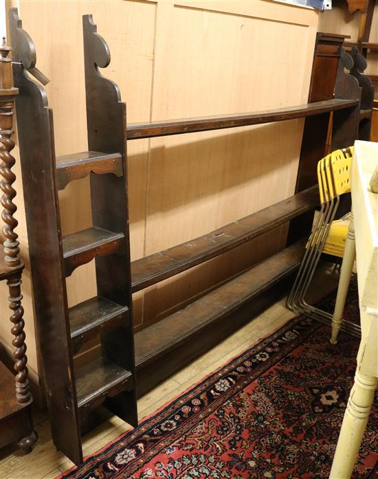 AN 18th century style oak plate rack W.221cm